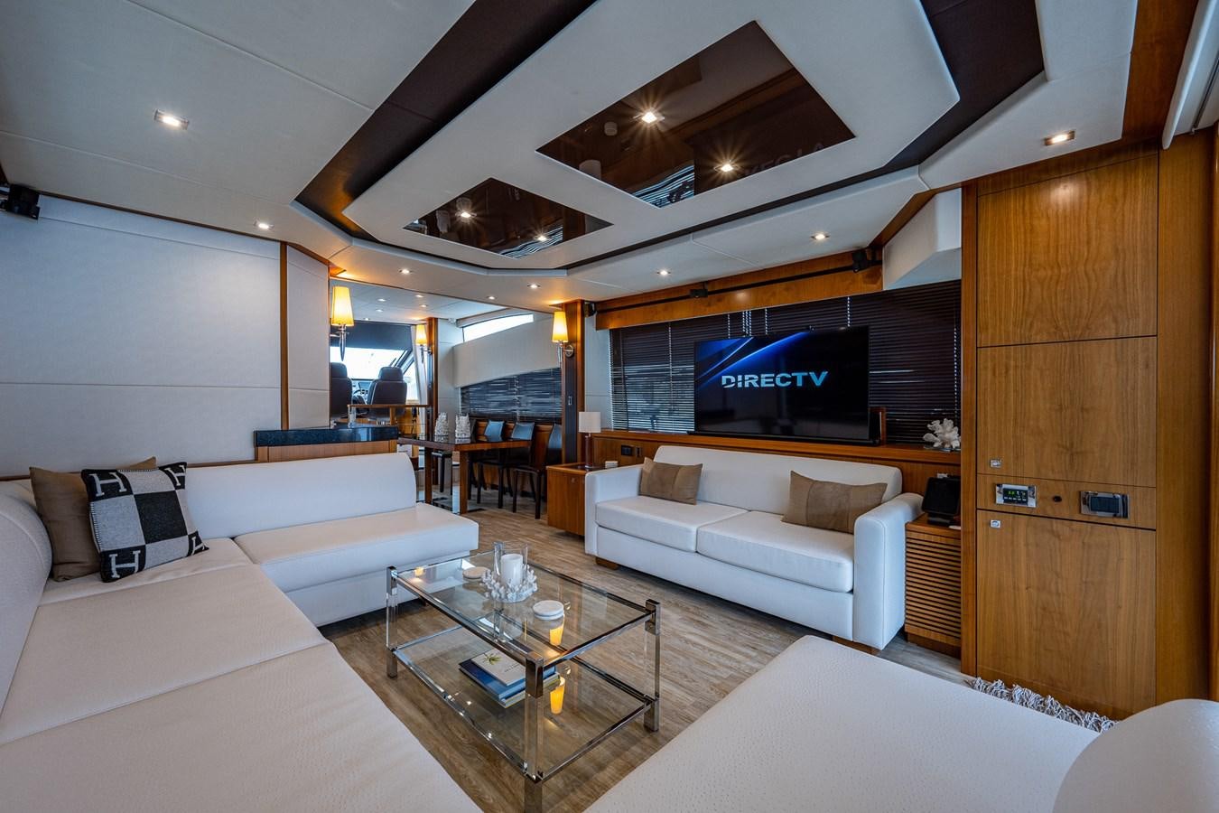 a living room with a large screen aboard 212 Yacht for Sale
