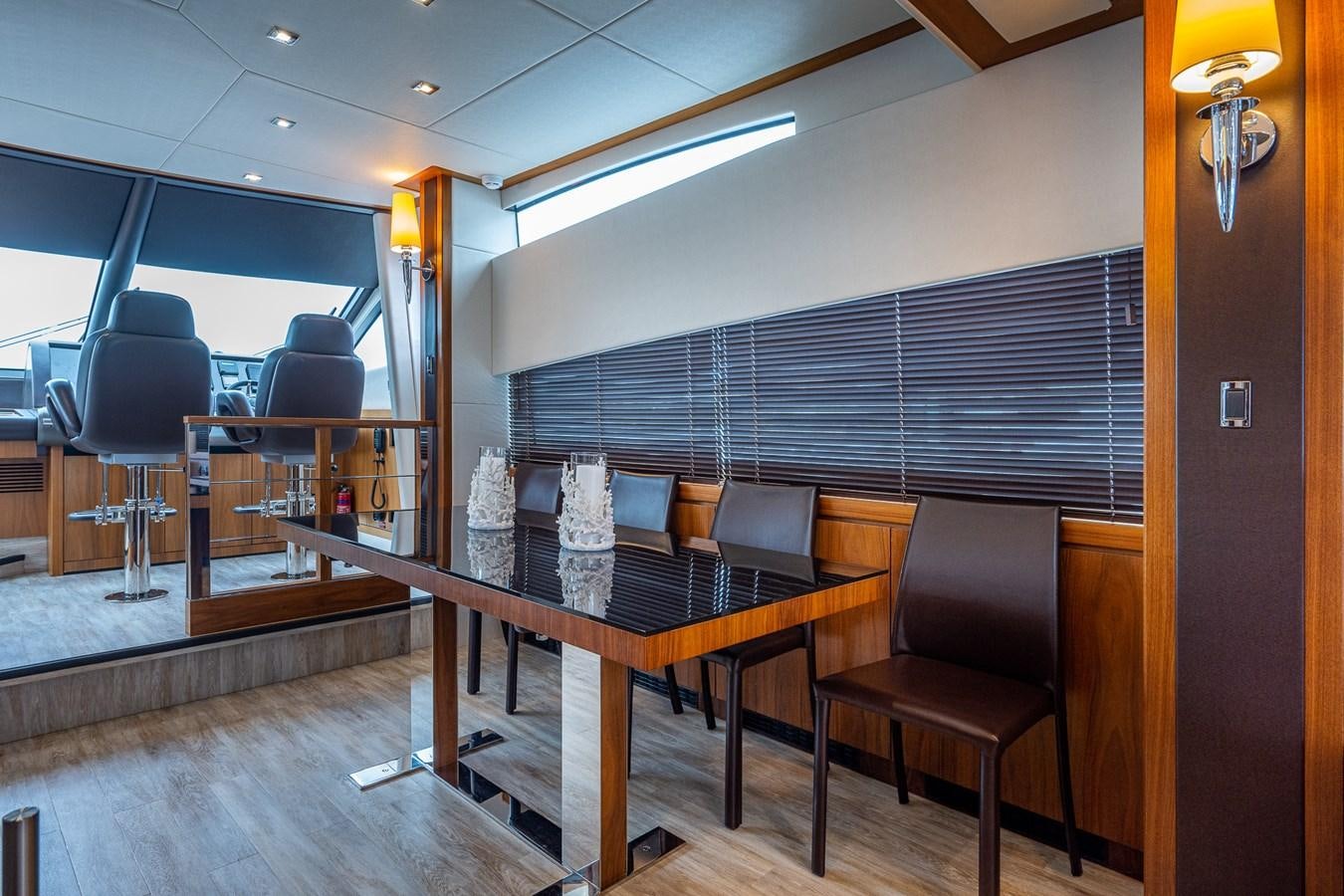 a room with a table and chairs aboard 212 Yacht for Sale