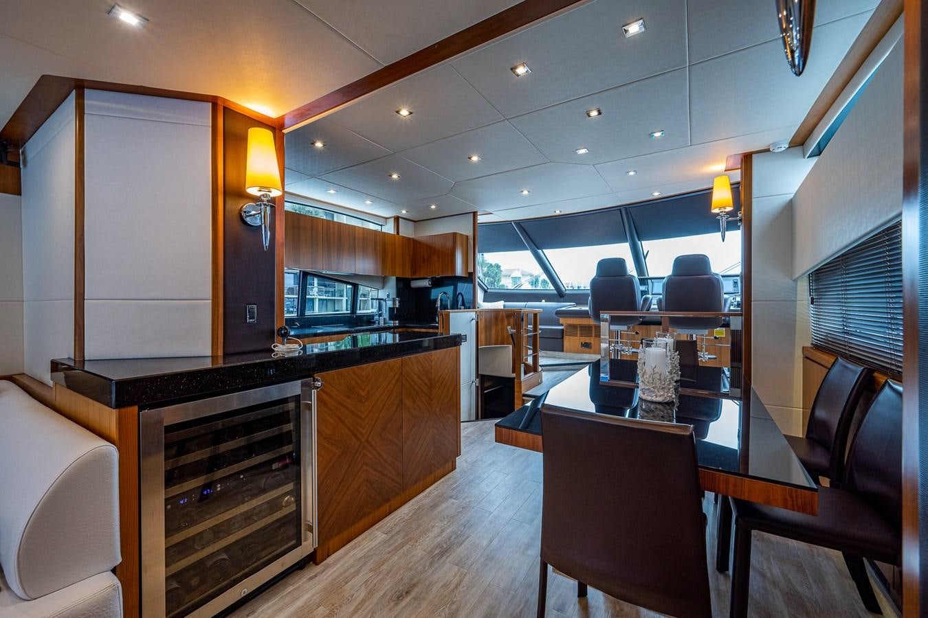 a large kitchen with a bar and bar area aboard 212 Yacht for Sale