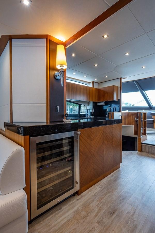 a kitchen with a large island aboard 212 Yacht for Sale