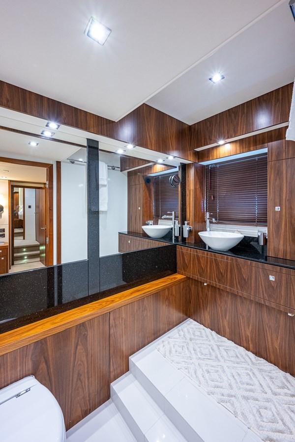 a bathroom with a large mirror aboard 212 Yacht for Sale