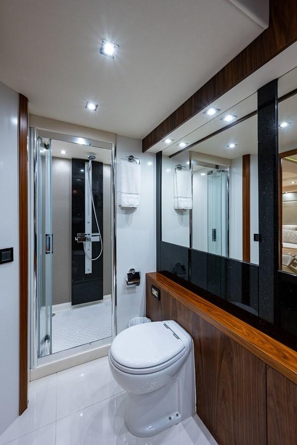 a bathroom with a glass shower aboard 212 Yacht for Sale