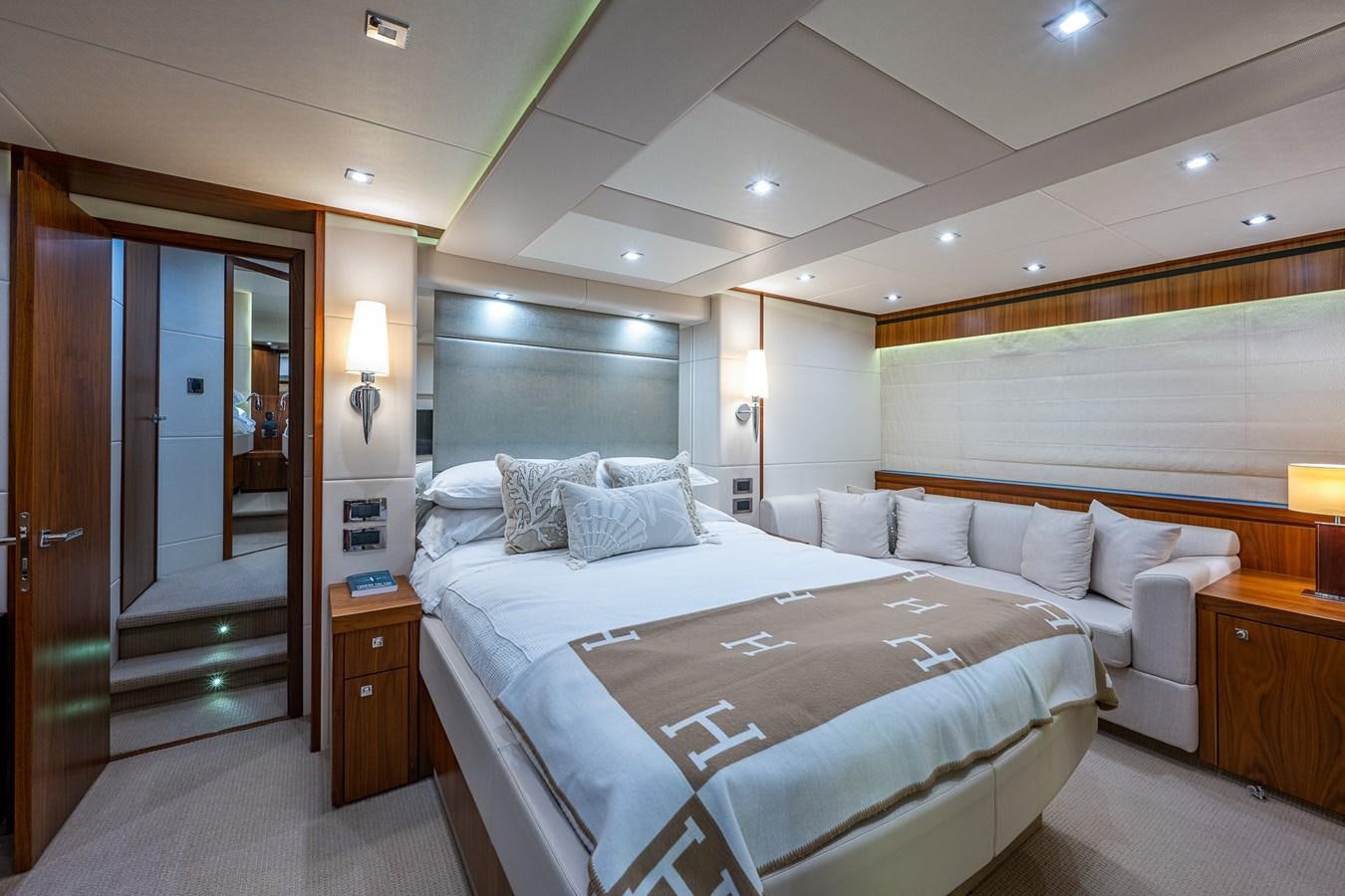 a large bedroom with a bed aboard 212 Yacht for Sale