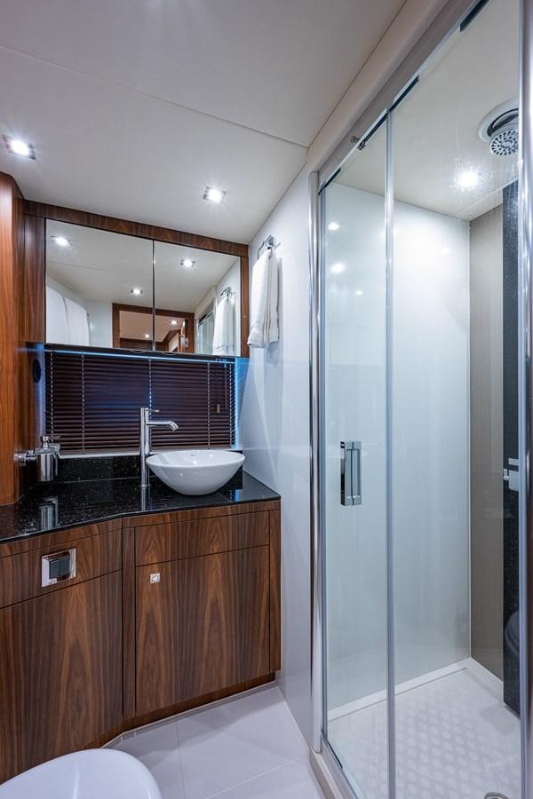 a bathroom with a sink and a shower aboard 212 Yacht for Sale