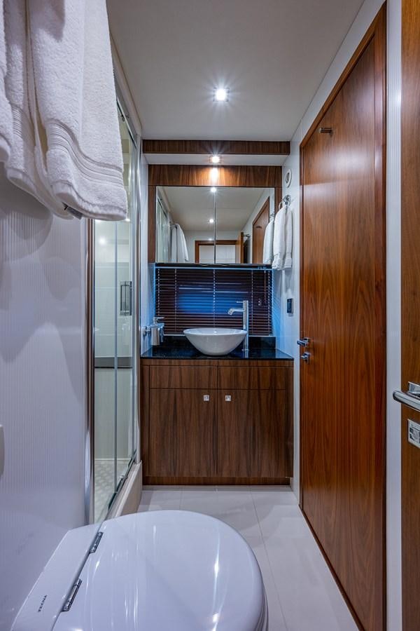 a bathroom with a sink and a bathtub aboard 212 Yacht for Sale