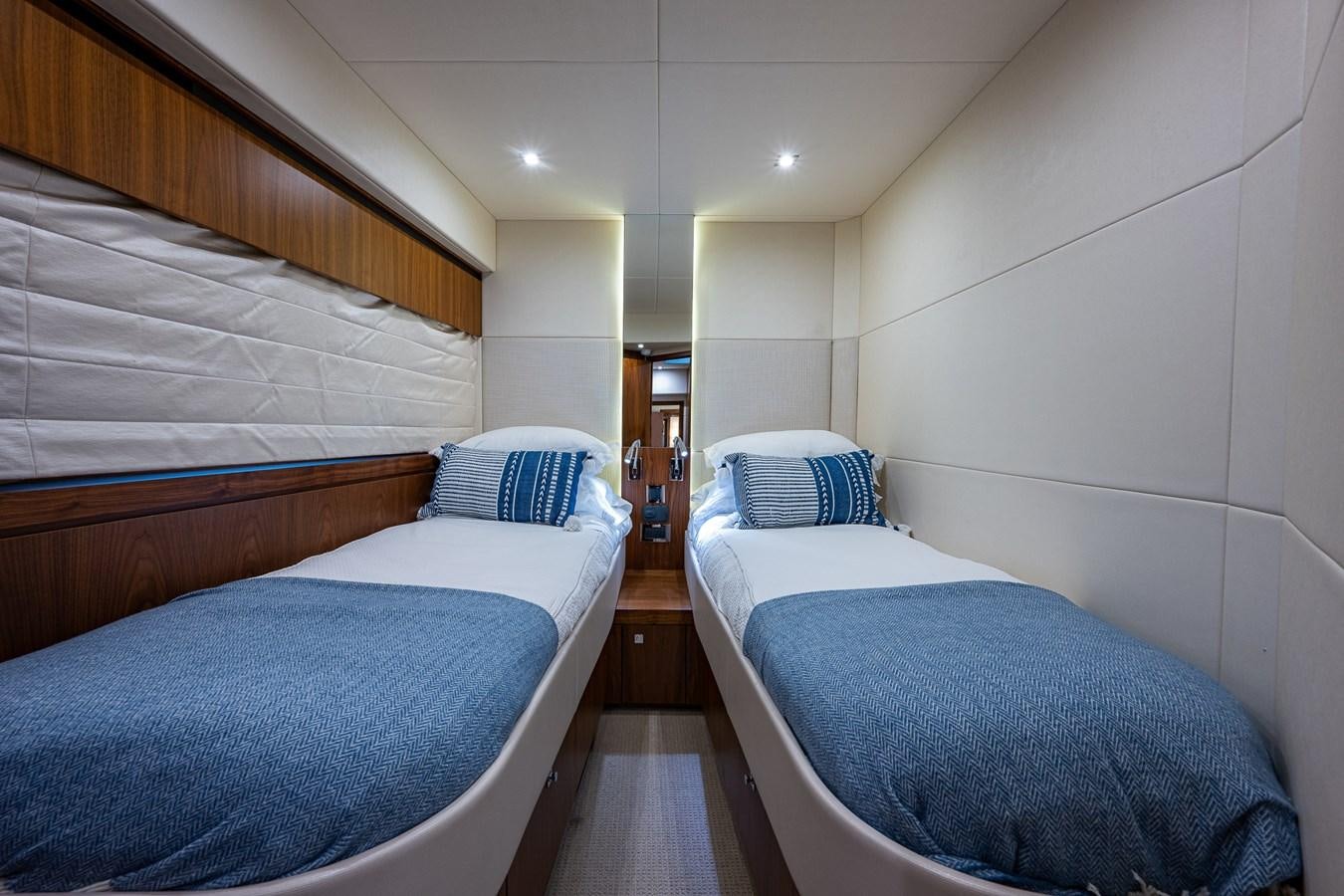 a room with two beds aboard 212 Yacht for Sale