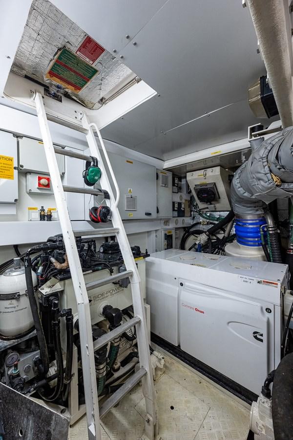 a room with a white machine and shelves aboard 212 Yacht for Sale