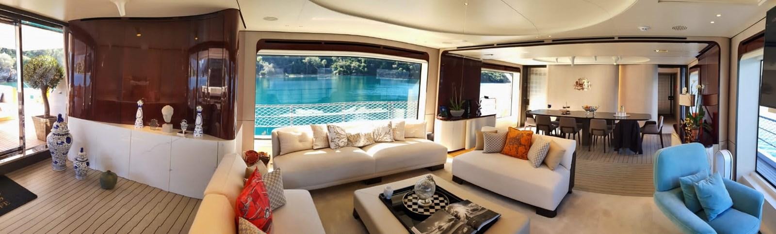 a living room with a large window aboard GOLDEN LIFE Yacht for Sale