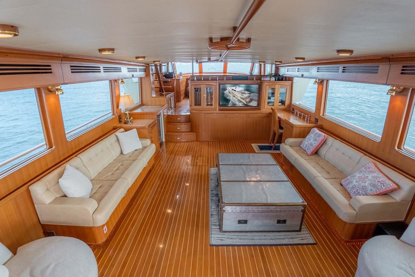 a living room with a wood floor aboard SOMEDAY CAME Yacht for Sale
