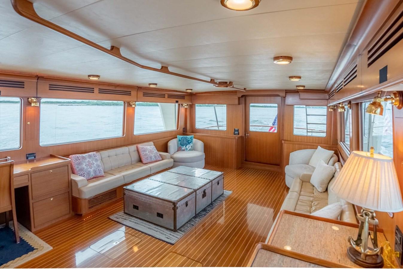 a living room with a couch and a coffee table aboard SOMEDAY CAME Yacht for Sale