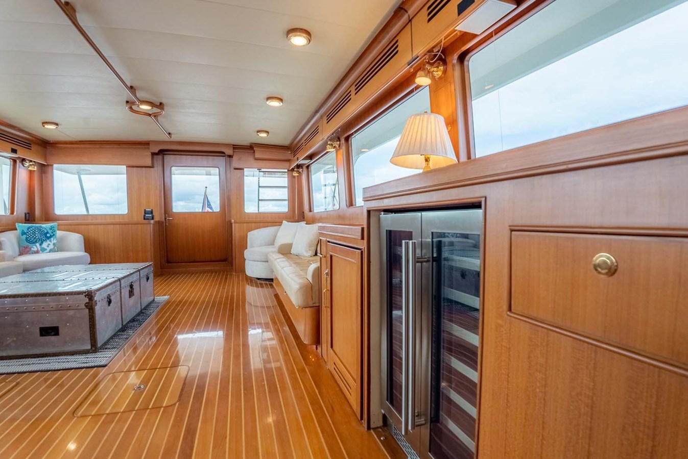 a room with a wood floor and a bed and a door aboard SOMEDAY CAME Yacht for Sale