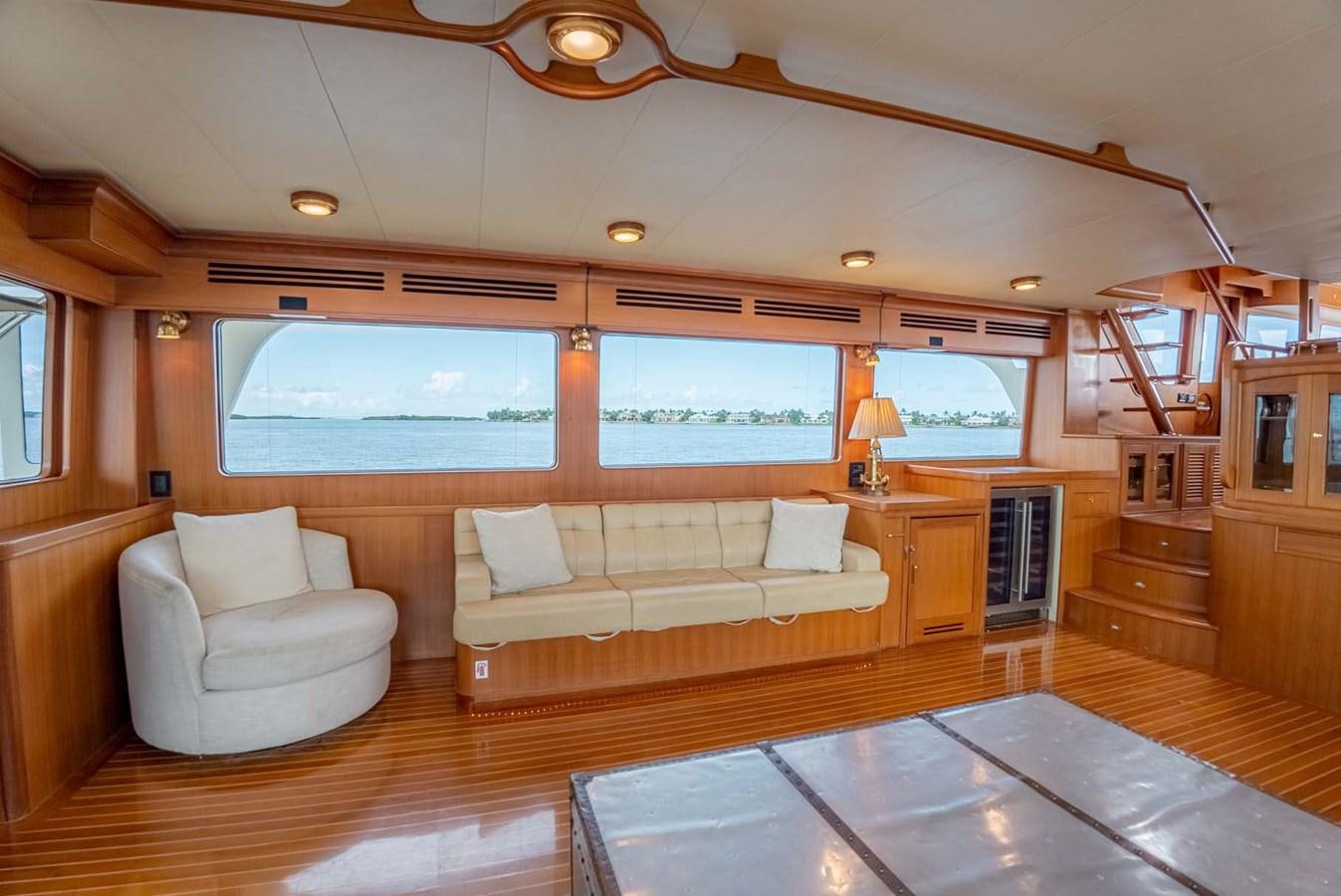 a living room with a couch and a table aboard SOMEDAY CAME Yacht for Sale