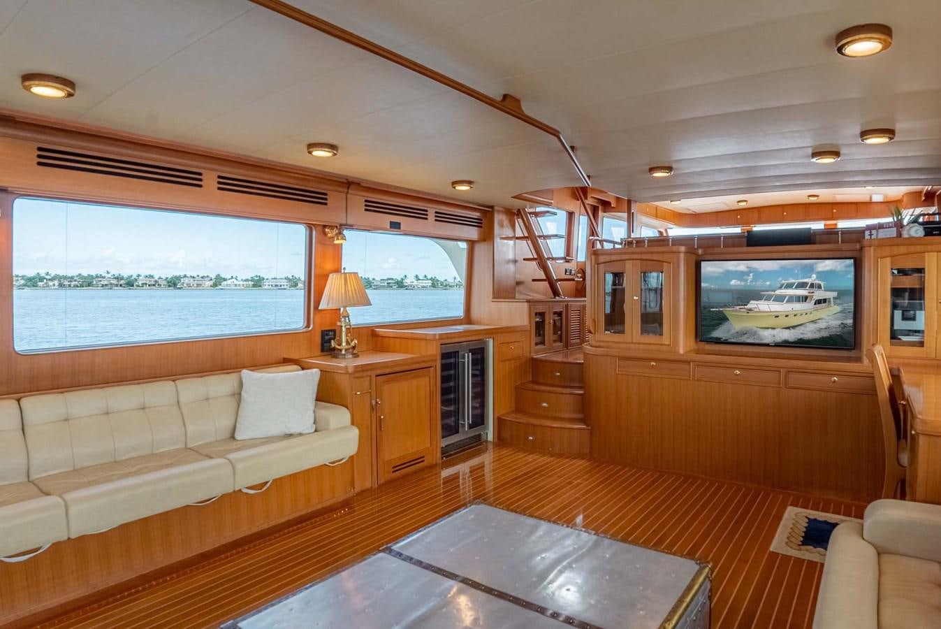 a living room with a large kitchen aboard SOMEDAY CAME Yacht for Sale