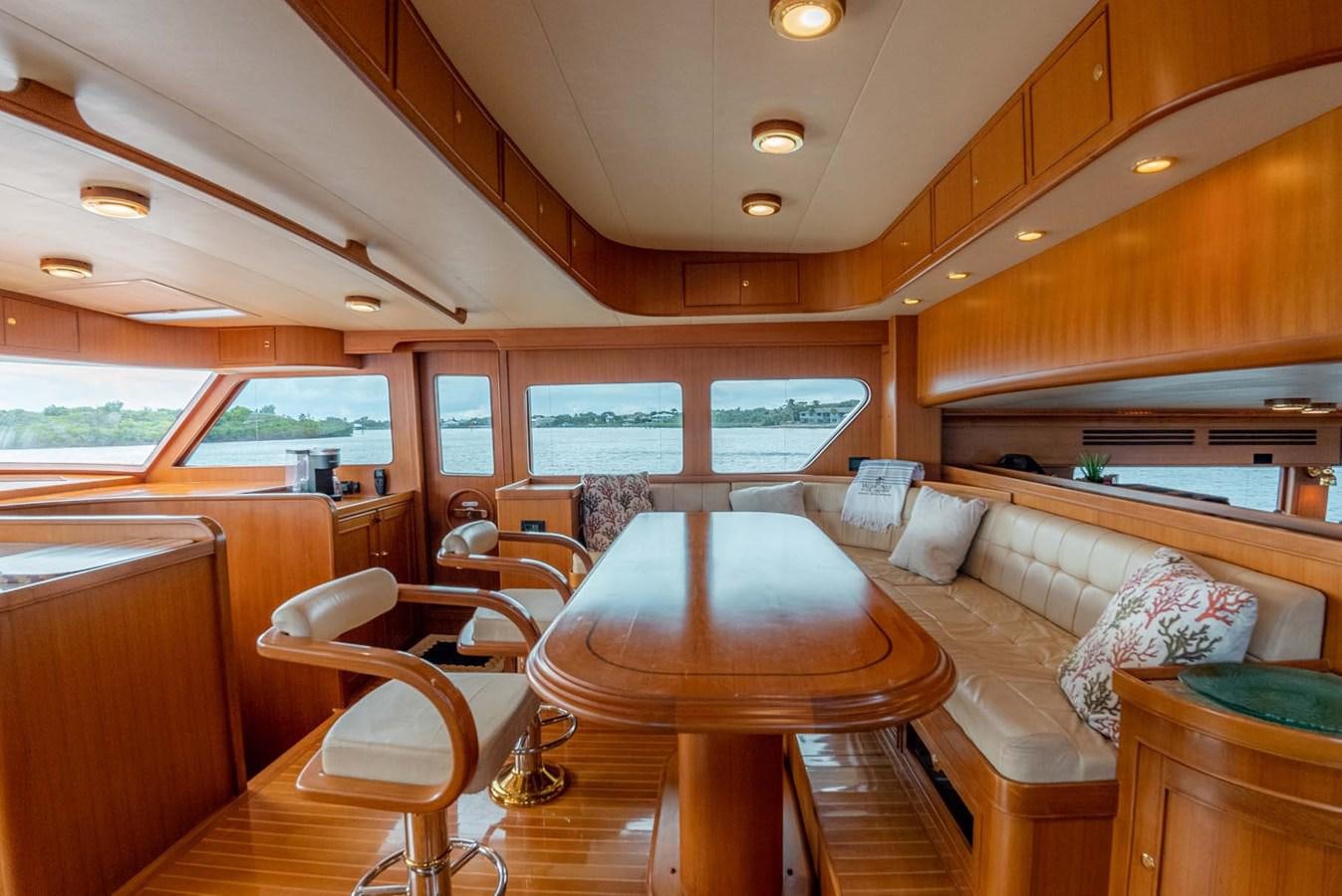 a living room with a couch and a table aboard SOMEDAY CAME Yacht for Sale