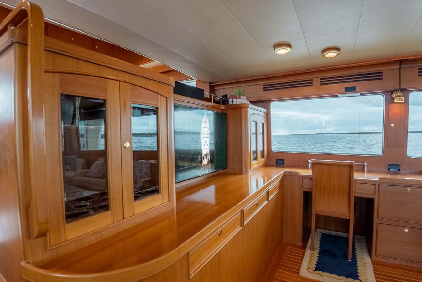 a kitchen with wooden cabinets aboard SOMEDAY CAME Yacht for Sale