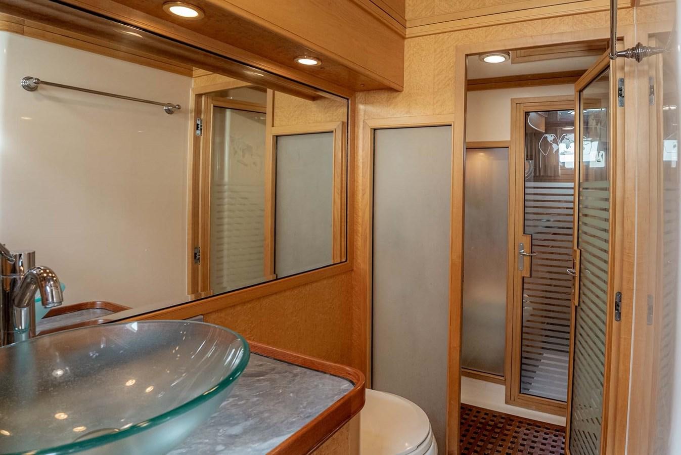 a bathroom with a glass shower aboard SOMEDAY CAME Yacht for Sale