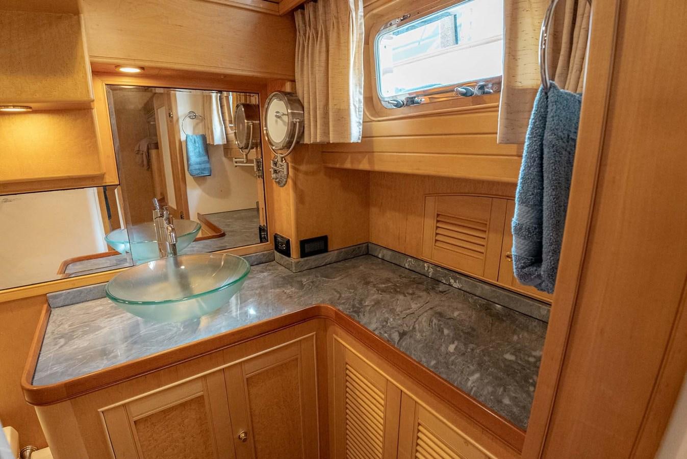 a bathroom with a large countertop aboard SOMEDAY CAME Yacht for Sale