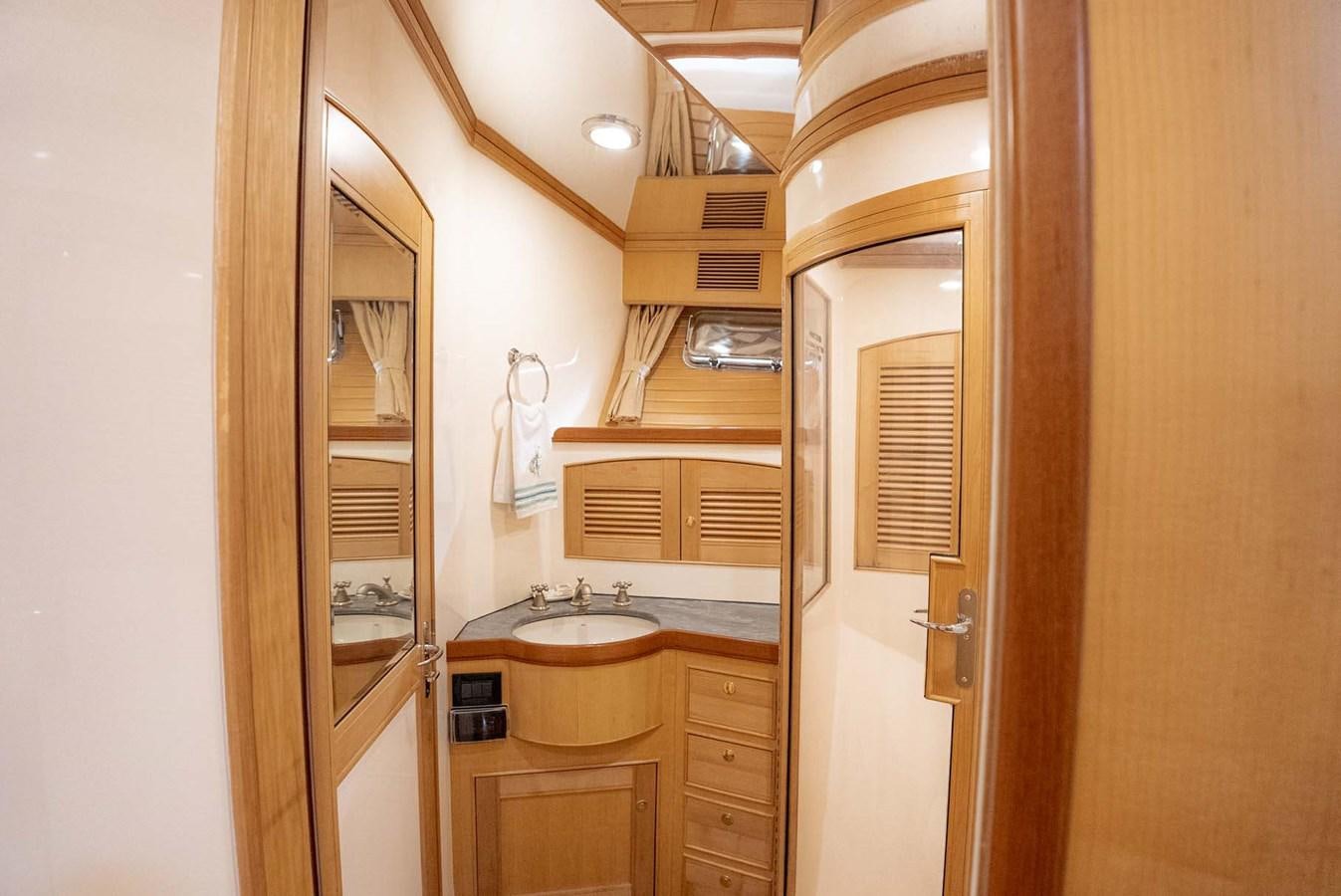 a bathroom with a sink and a mirror aboard SOMEDAY CAME Yacht for Sale