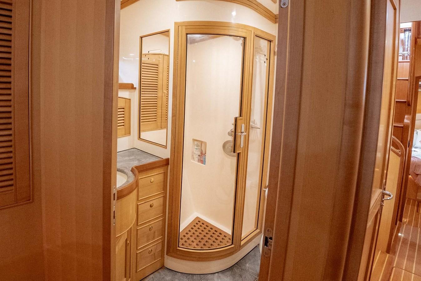 a bathroom with a glass shower door aboard SOMEDAY CAME Yacht for Sale