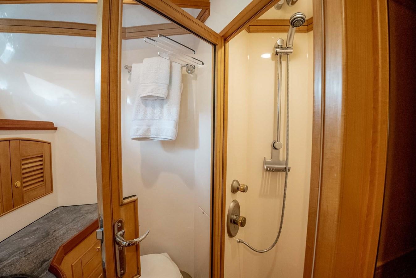a bathroom with a shower and a toilet aboard SOMEDAY CAME Yacht for Sale