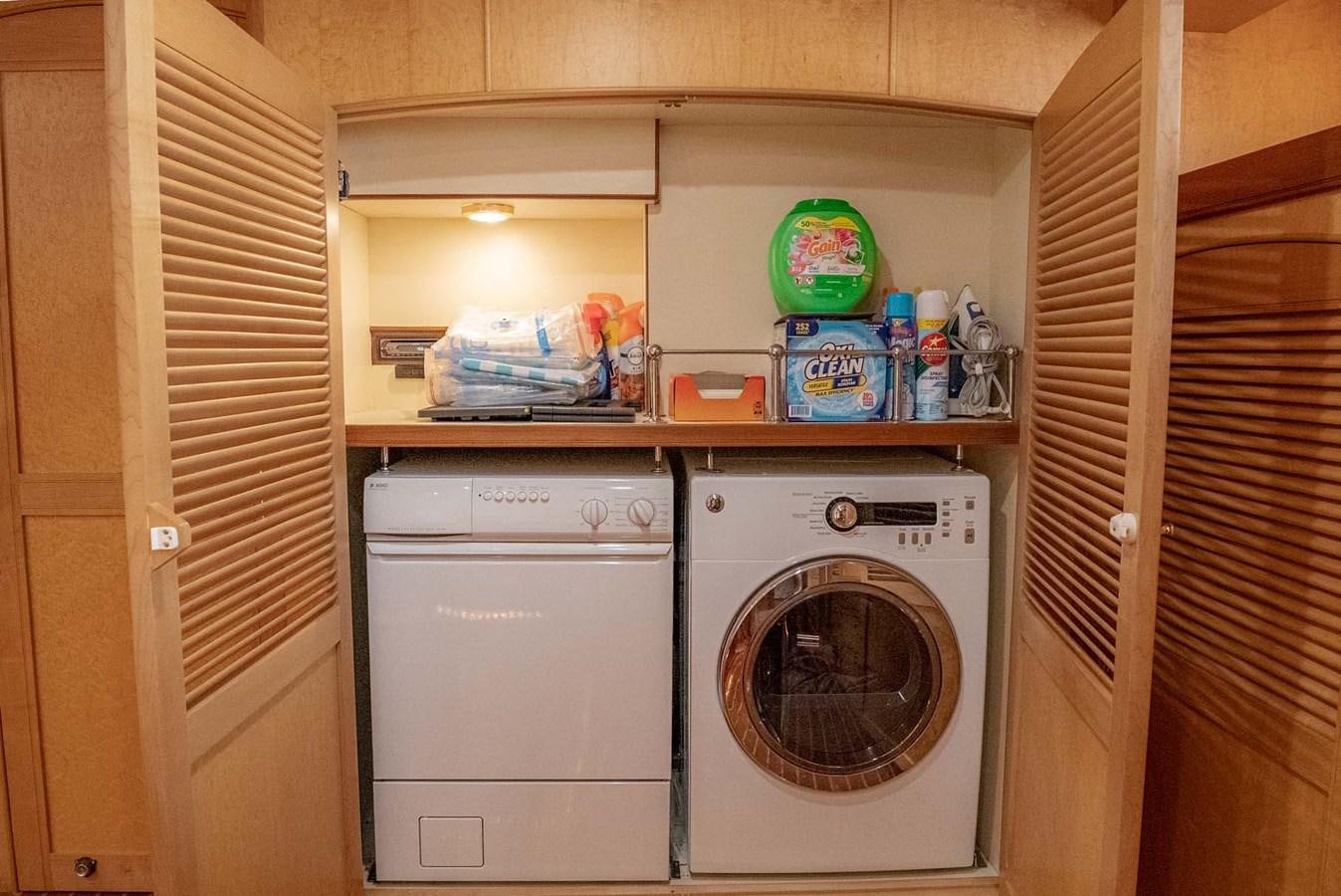 a small kitchen with a washer and dryer aboard SOMEDAY CAME Yacht for Sale