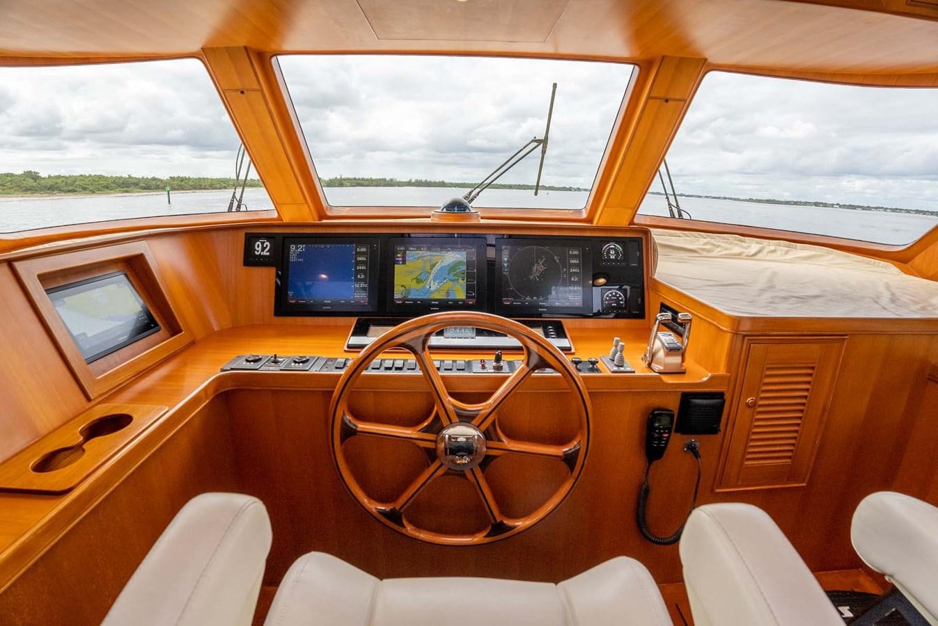 inside of a vehicle with a large screen and a steering wheel aboard SOMEDAY CAME Yacht for Sale