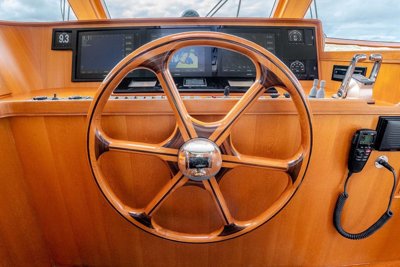 a steering wheel and dashboard of a car aboard SOMEDAY CAME Yacht for Sale