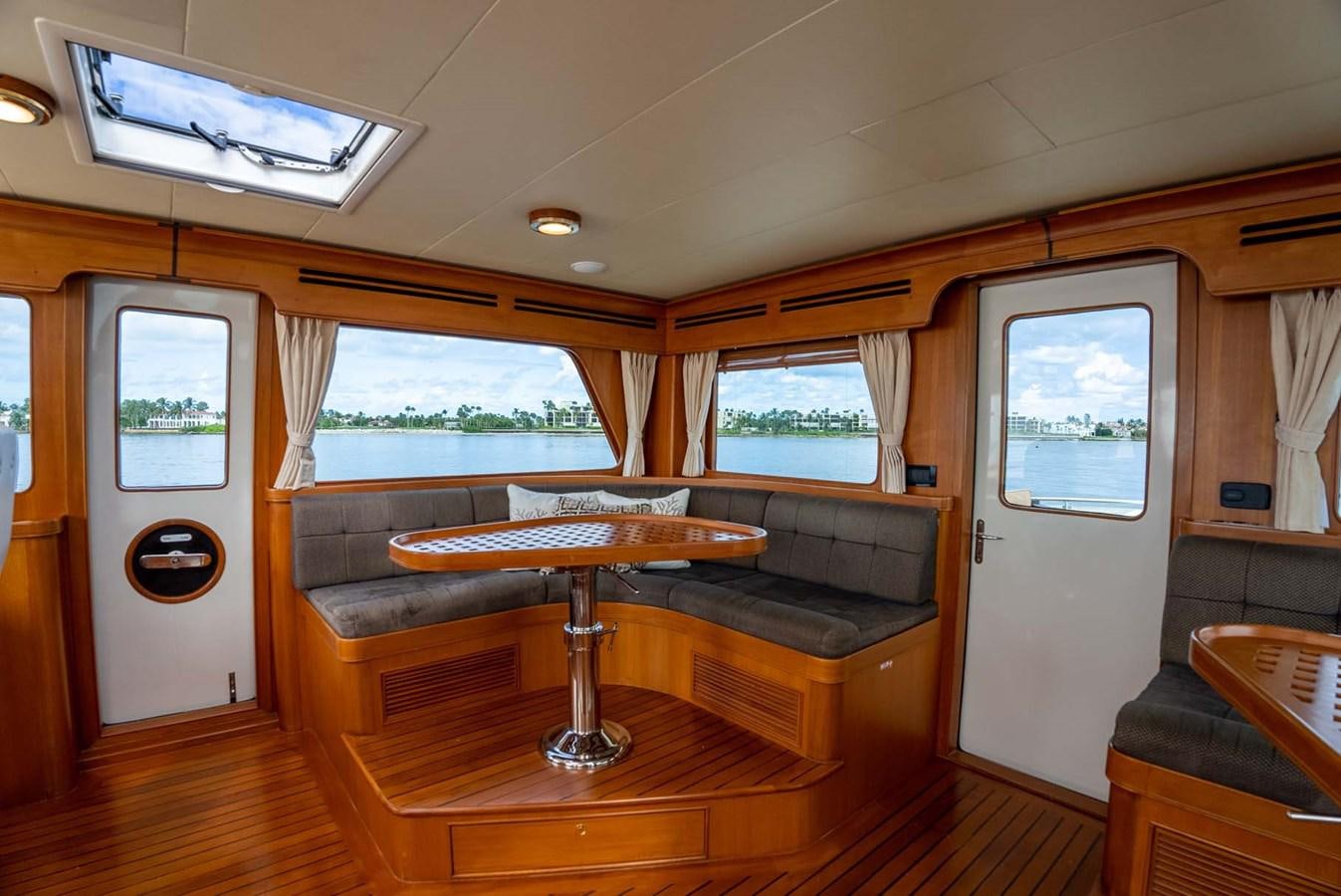 a room with a couch and a table aboard SOMEDAY CAME Yacht for Sale