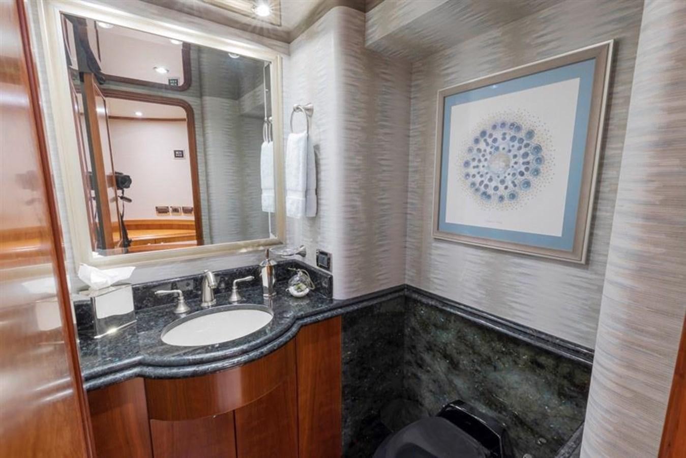 a bathroom with a sink and a mirror aboard NO NAME 112 Yacht for Sale