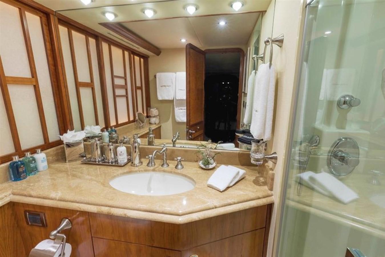 a bathroom with a sink and a mirror aboard NO NAME 112 Yacht for Sale