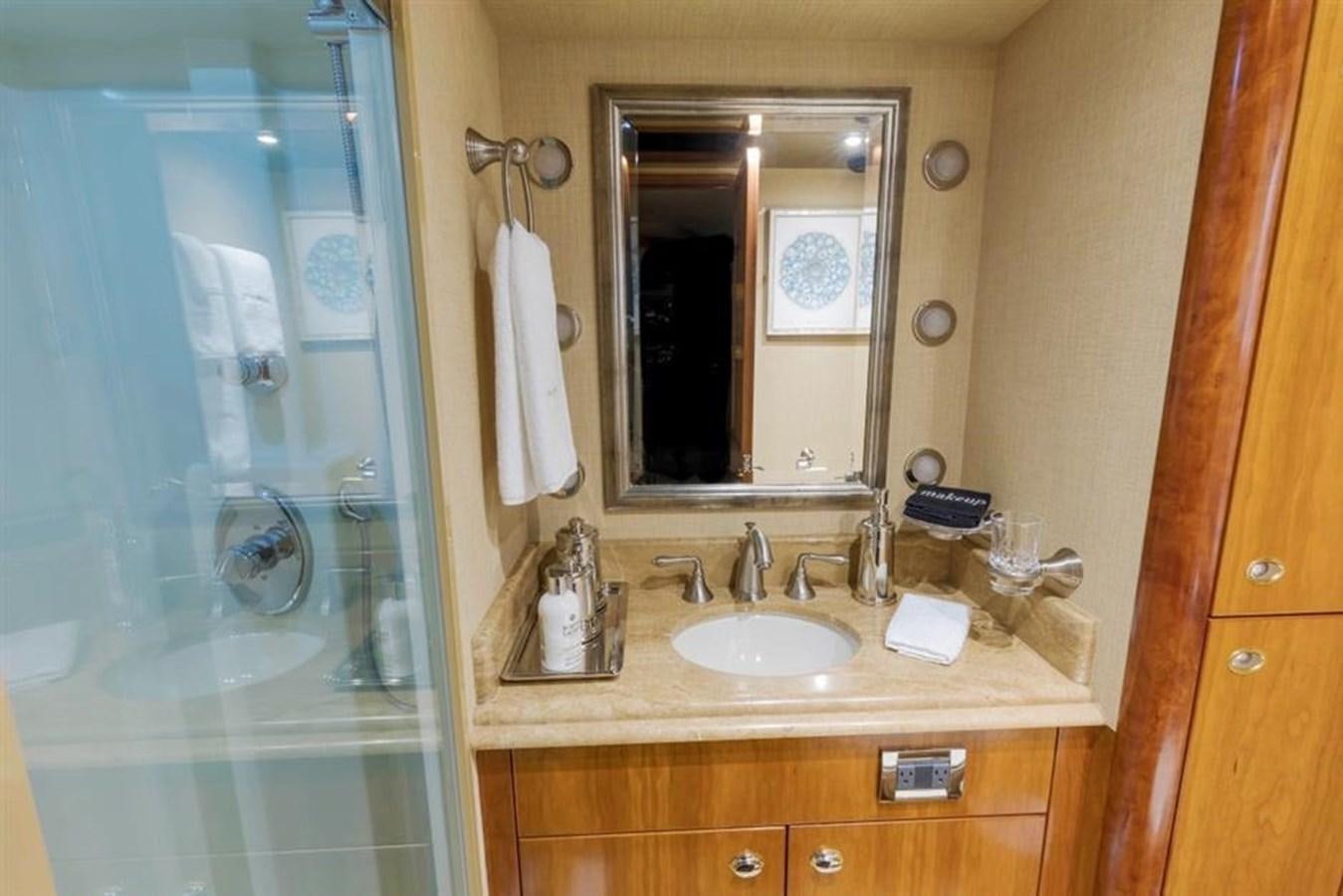 a bathroom with a large mirror aboard NO NAME 112 Yacht for Sale