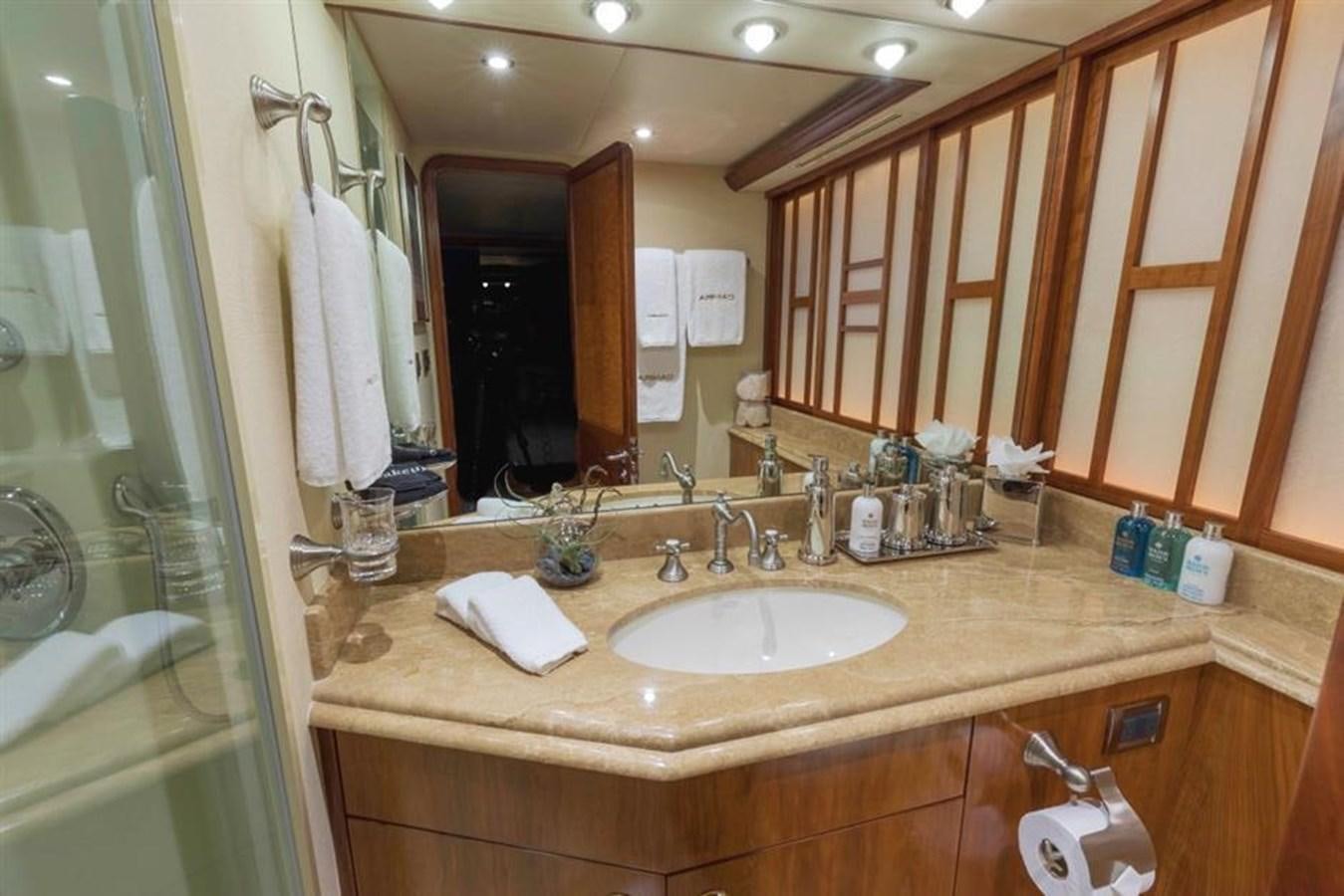 a bathroom with a sink and a mirror aboard NO NAME 112 Yacht for Sale