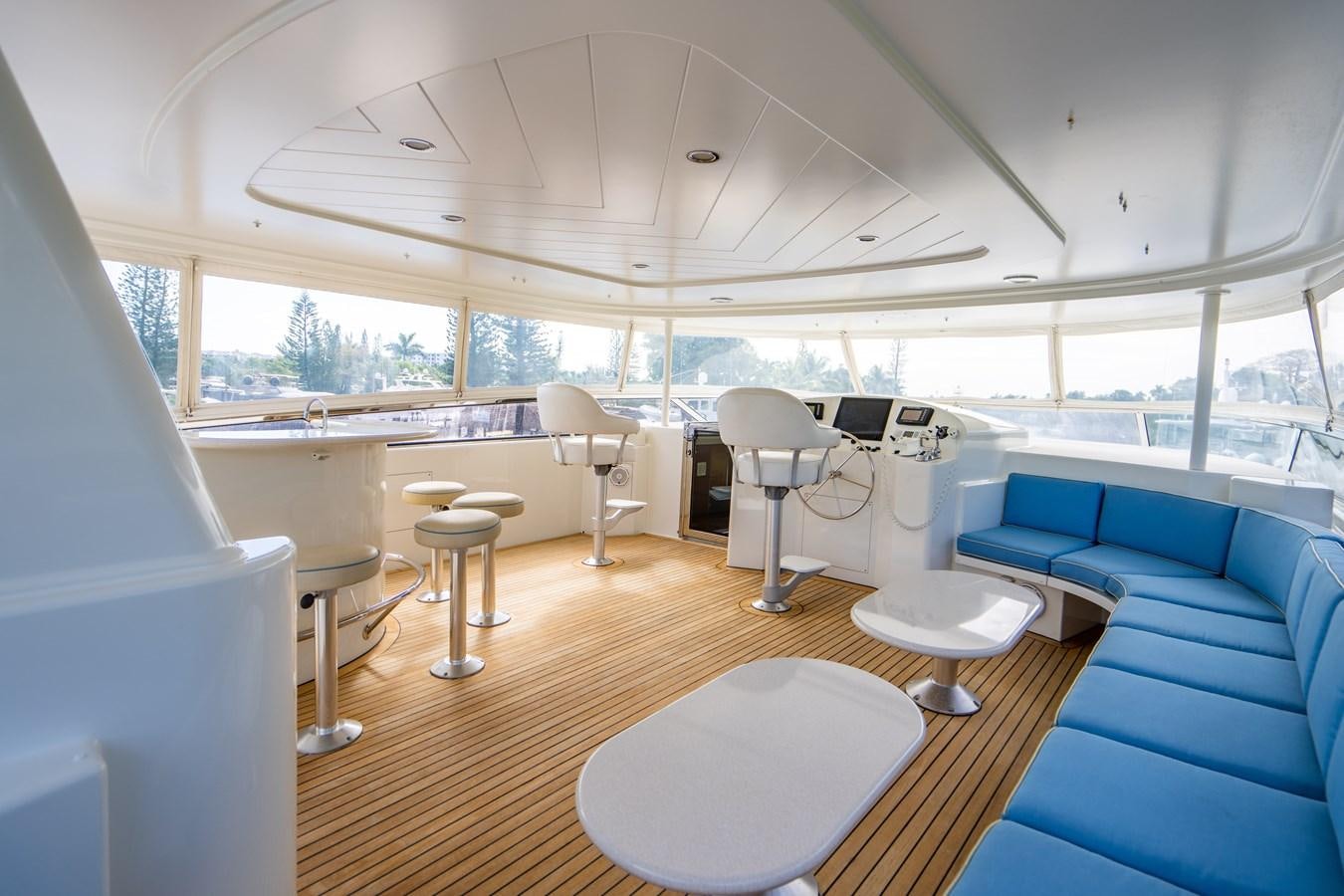 a room with a table chairs and a large window aboard NO NAME 112 Yacht for Sale