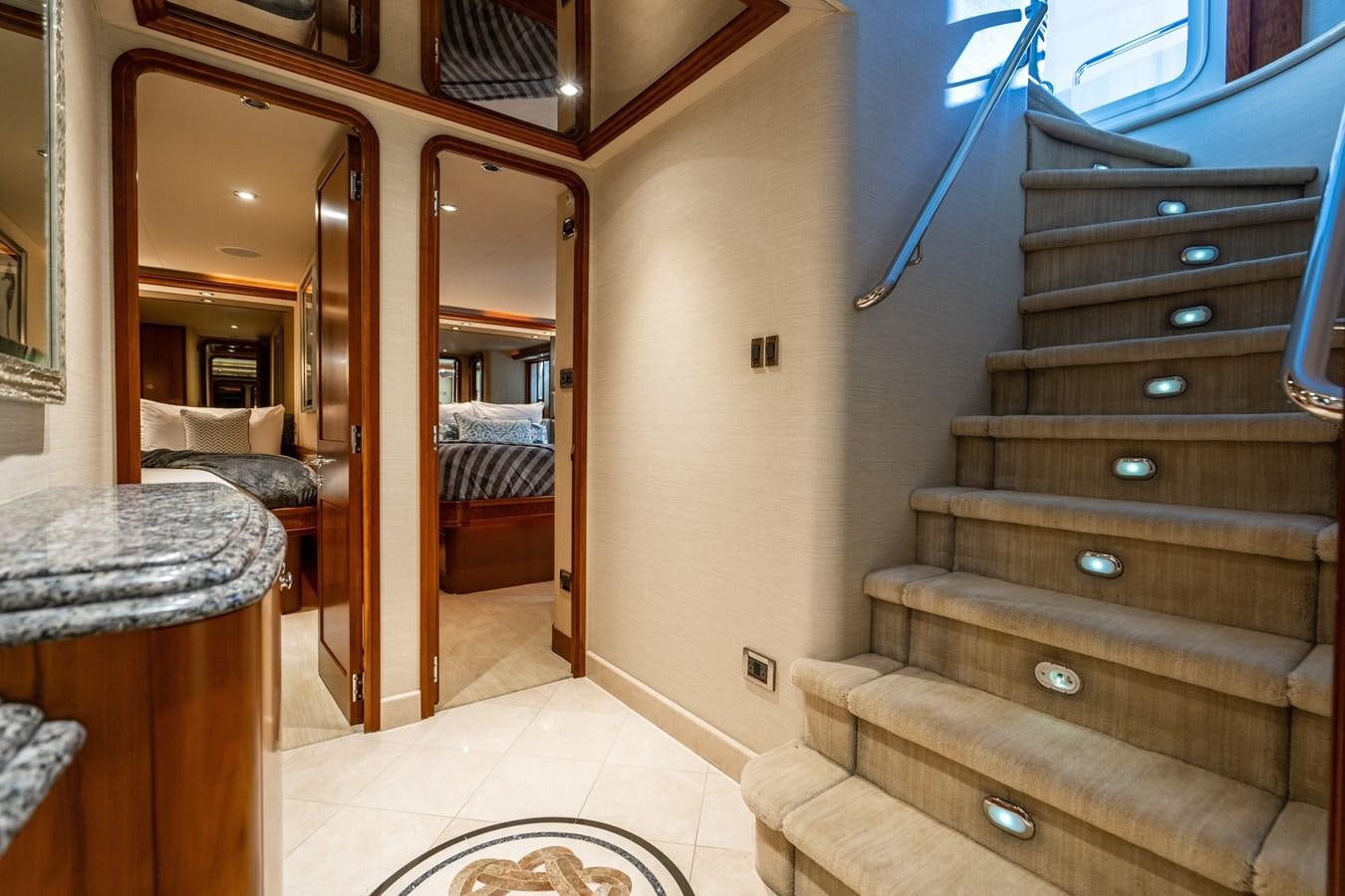 a wood staircase in a room aboard NO NAME 112 Yacht for Sale