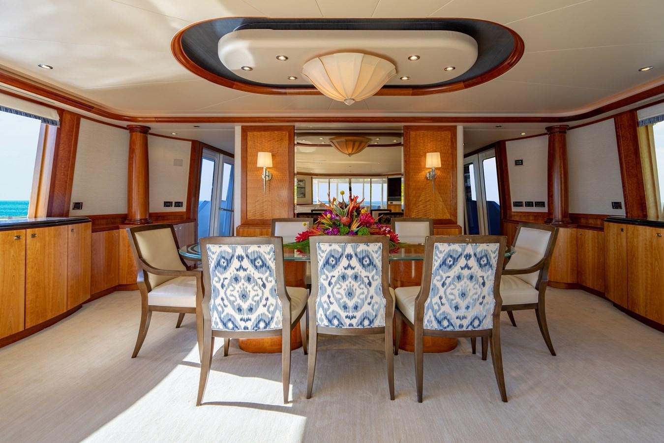 a dining room with a table and chairs aboard NO NAME 112 Yacht for Sale