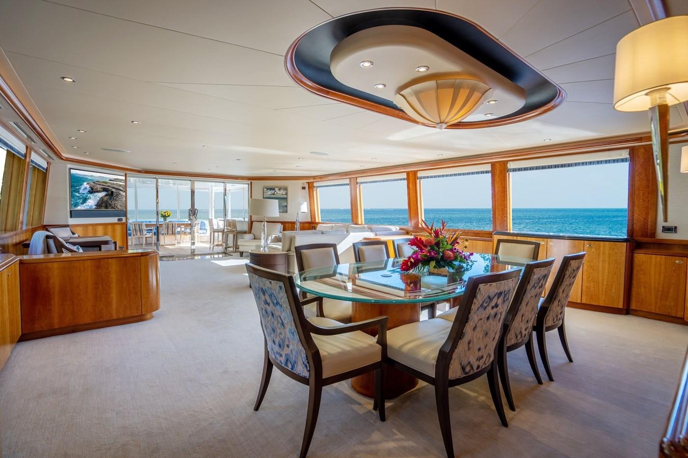 a large room with a table and chairs and a large window aboard NO NAME 112 Yacht for Sale
