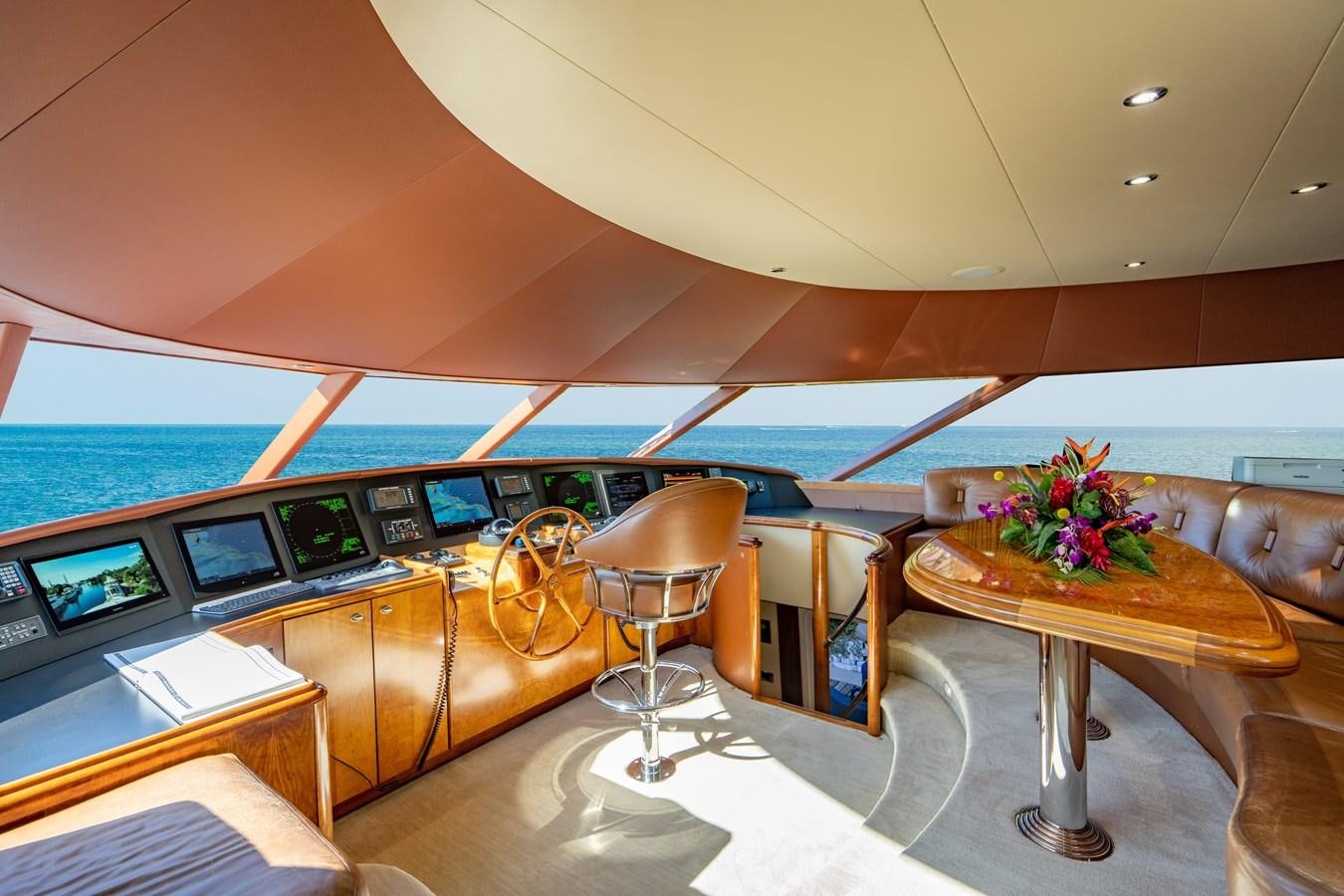 a room with a table and chairs aboard NO NAME 112 Yacht for Sale