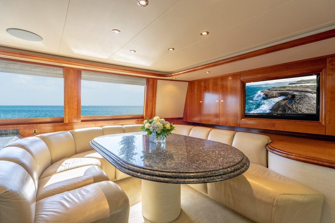 a room with a table and chairs aboard NO NAME 112 Yacht for Sale
