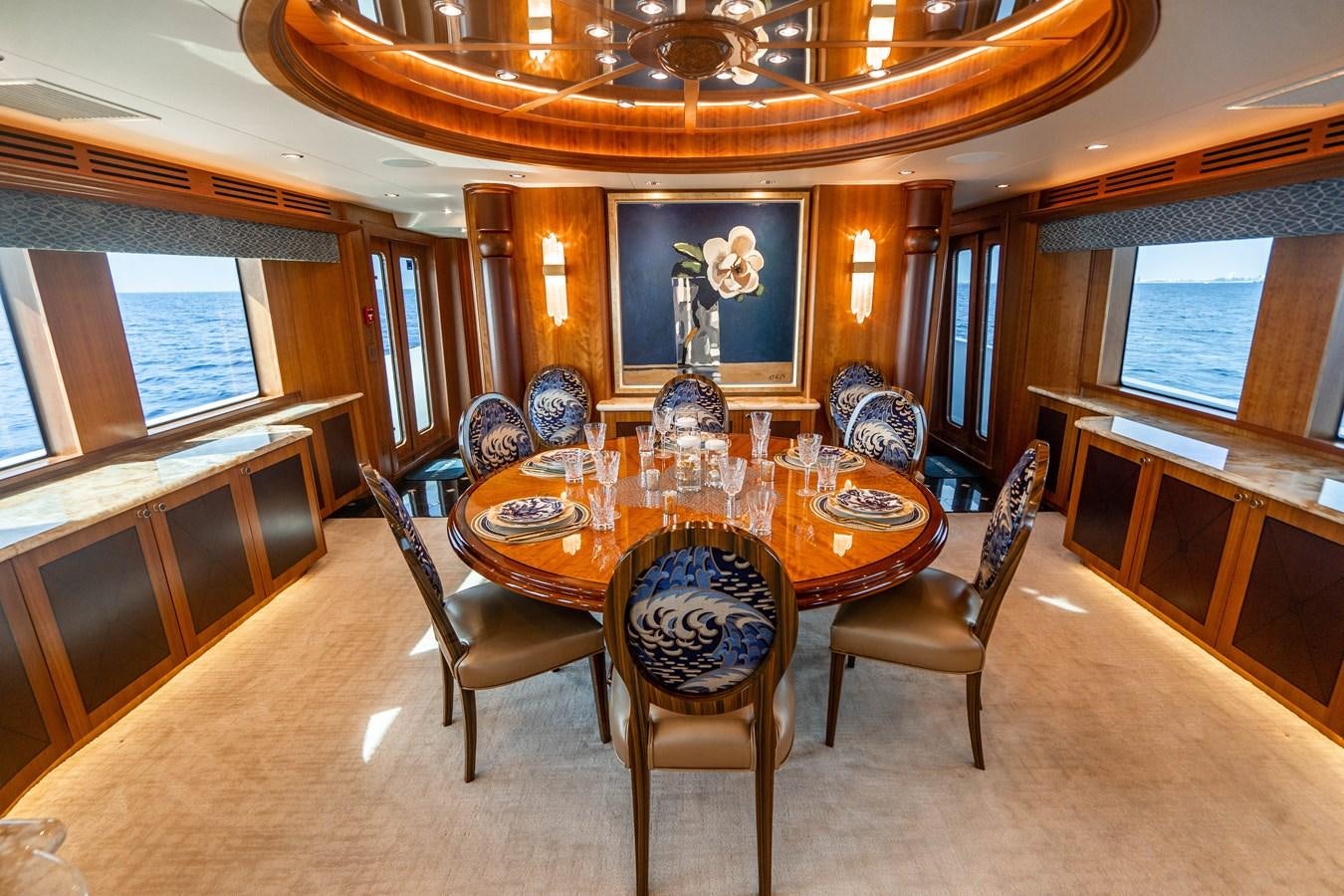 a dining room with a table aboard INEVITABLE Yacht for Sale