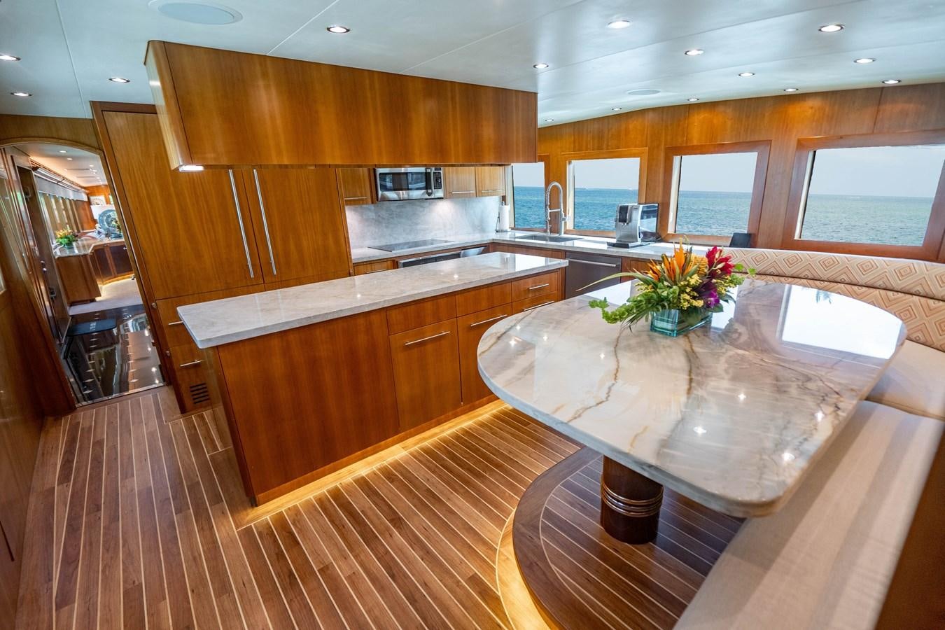 a kitchen with wooden cabinets aboard INEVITABLE Yacht for Sale