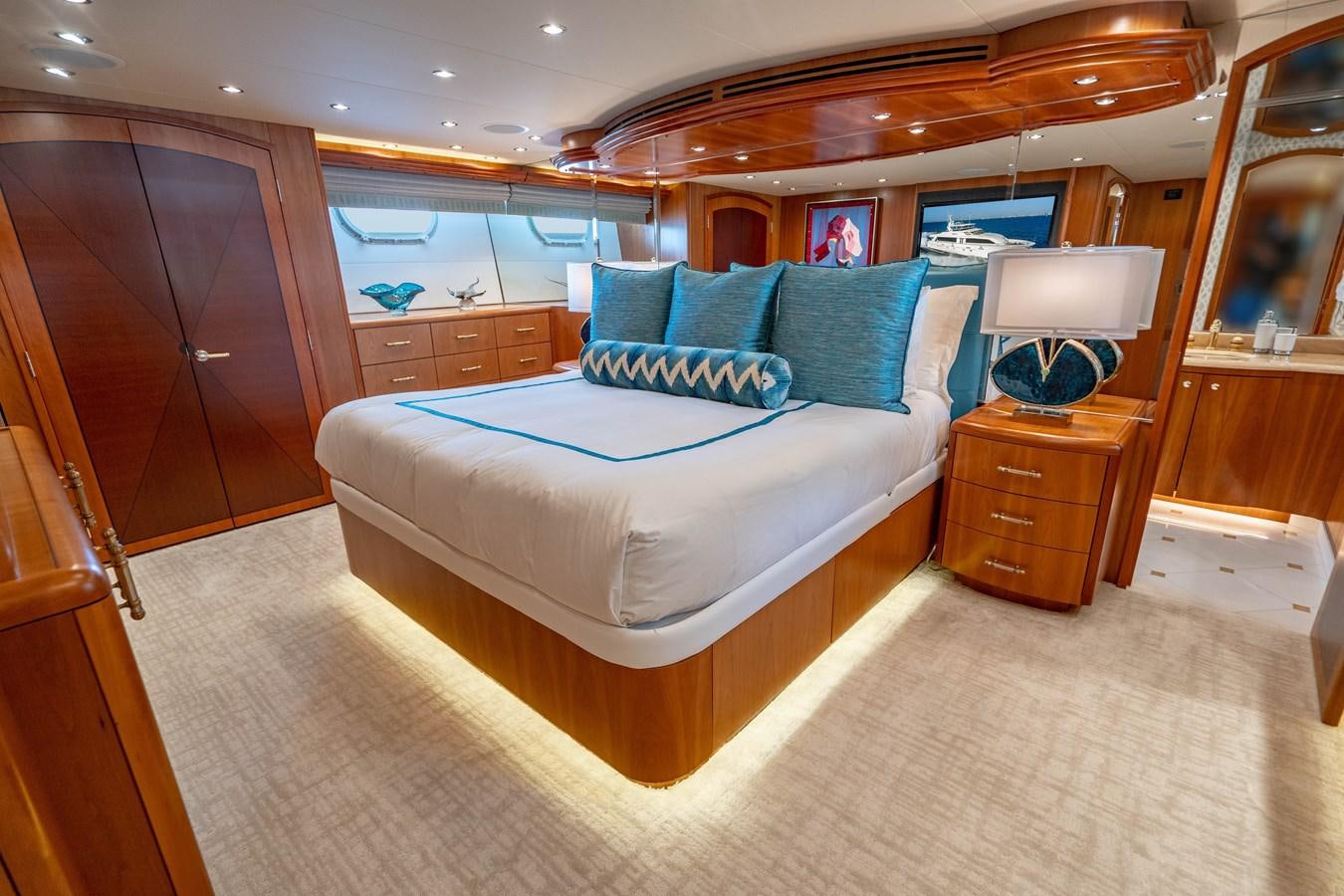 a large bedroom with a large bed aboard INEVITABLE Yacht for Sale