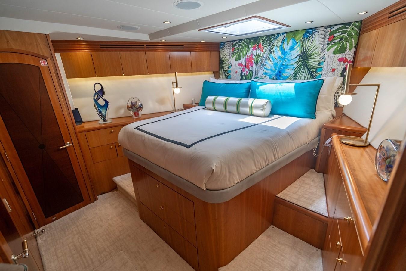 a bedroom with a bed and a desk aboard INEVITABLE Yacht for Sale