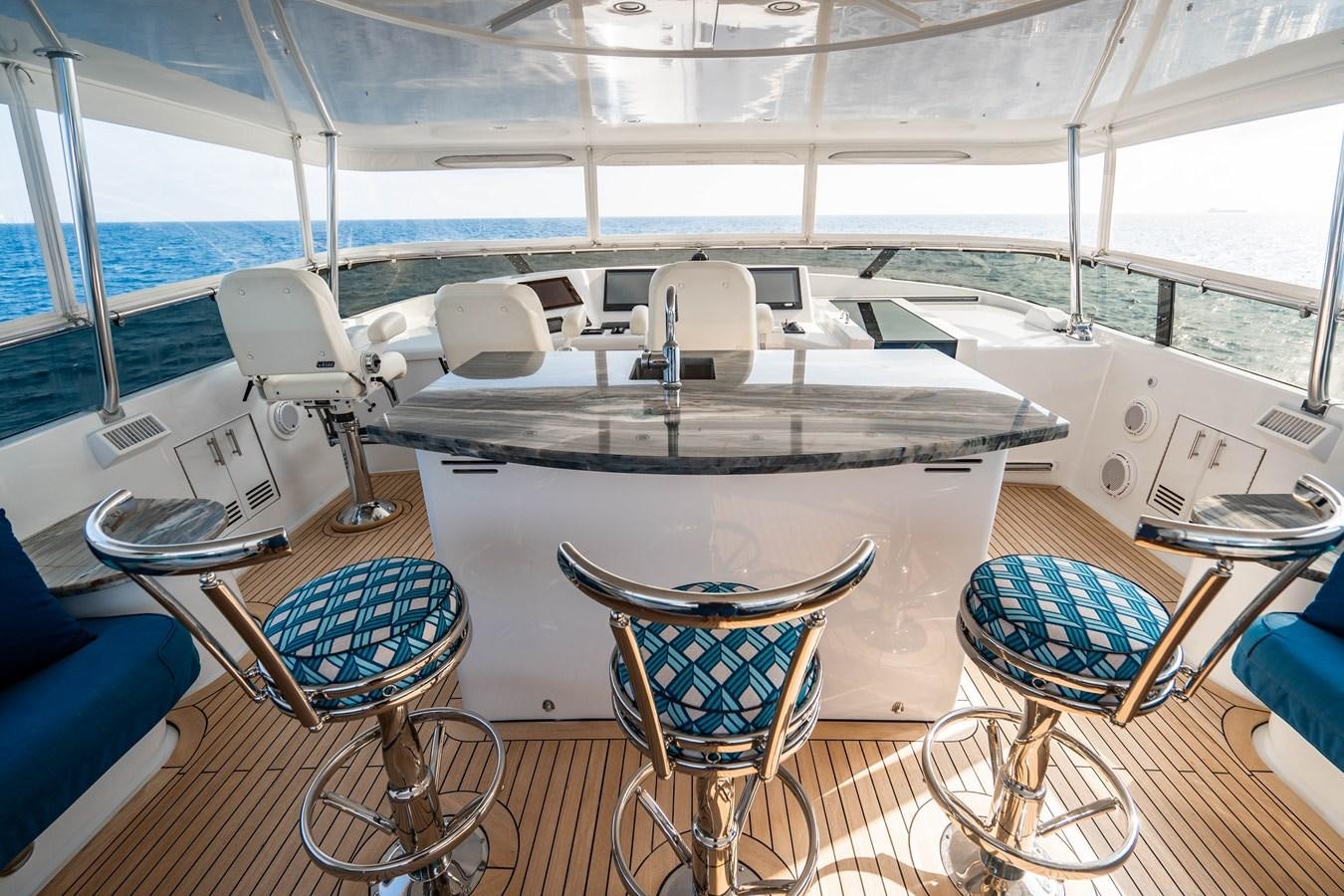 a boat with a table and chairs aboard INEVITABLE Yacht for Sale