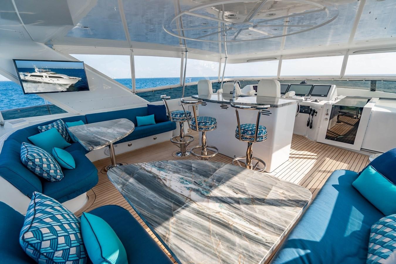 inside of a room with a large white table and chairs aboard INEVITABLE Yacht for Sale