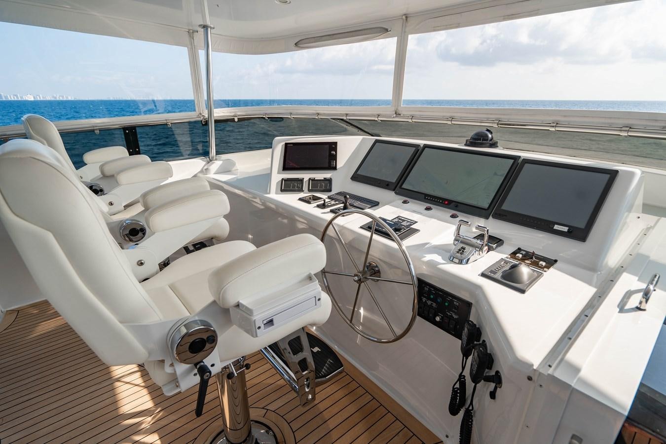 a white boat on a deck aboard INEVITABLE Yacht for Sale