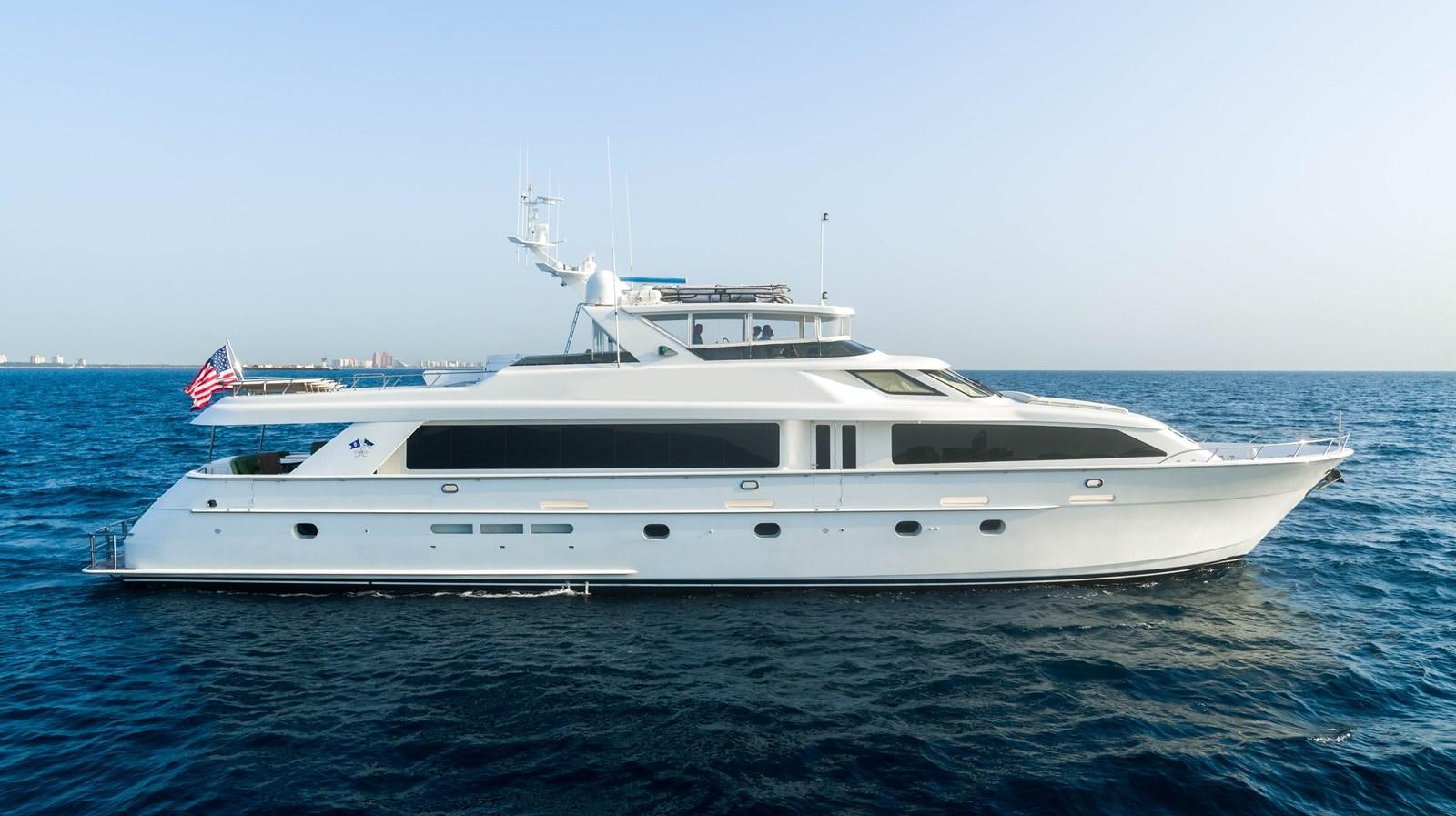 a white yacht in the water aboard INEVITABLE Yacht for Sale