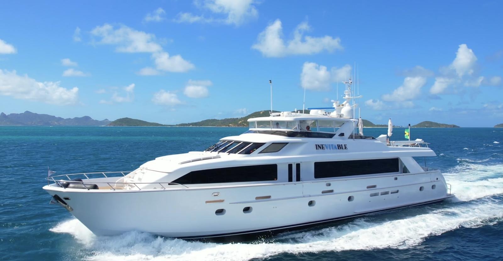 a white yacht on the water aboard INEVITABLE Yacht for Sale