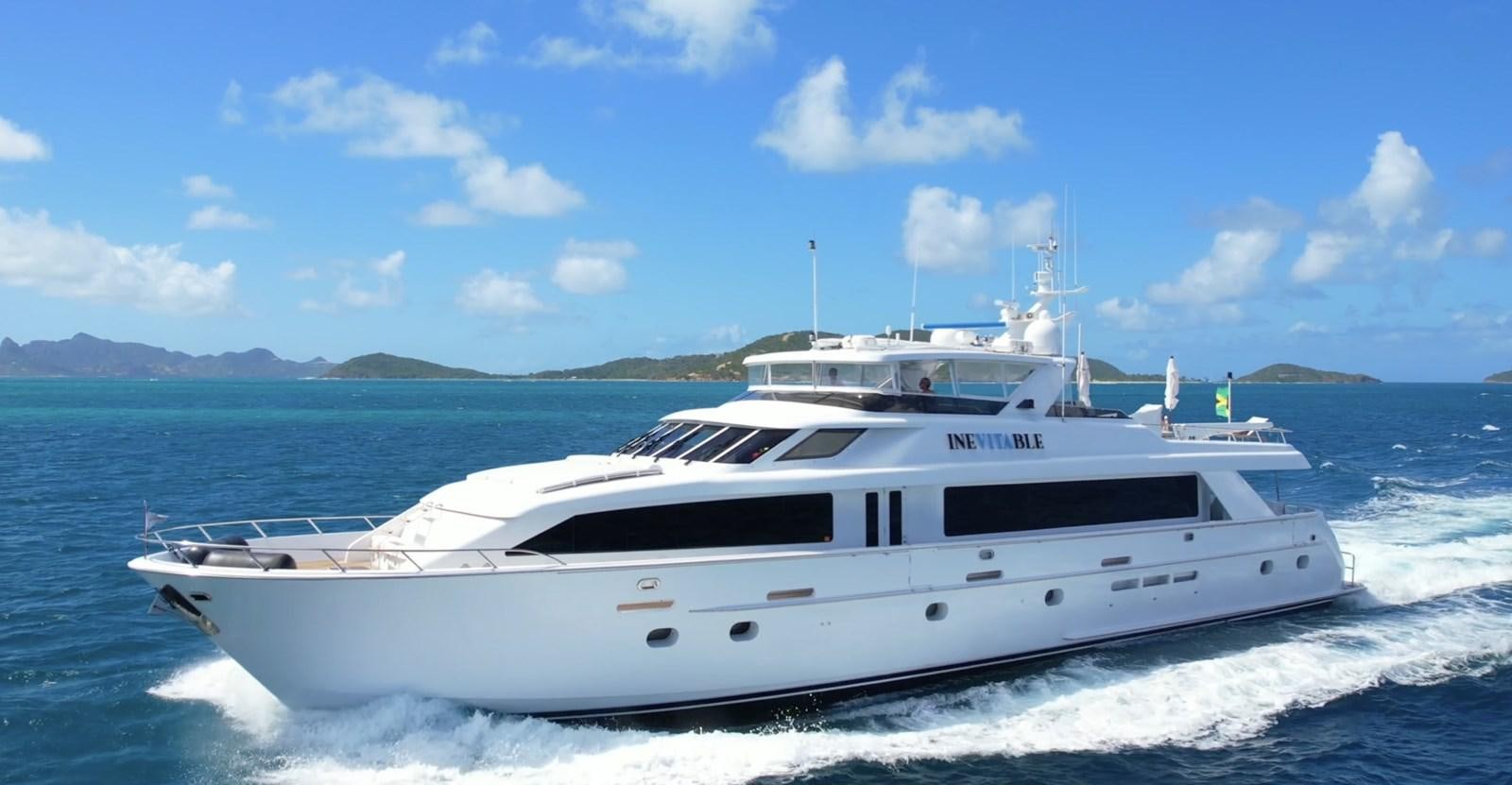 a white yacht on the water aboard INEVITABLE Yacht for Sale