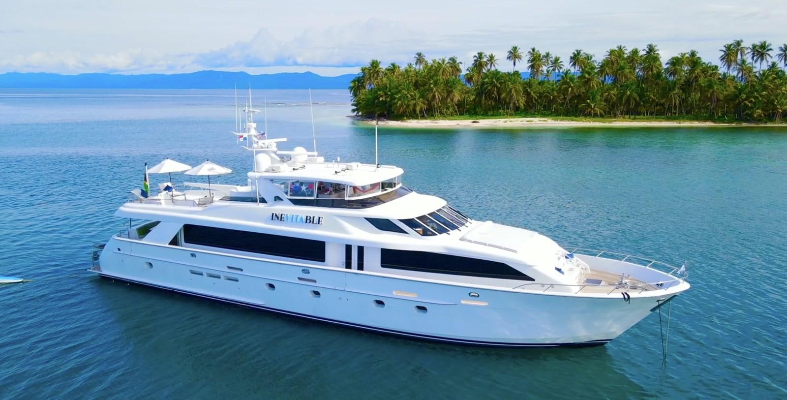 a white yacht on the water aboard INEVITABLE Yacht for Sale