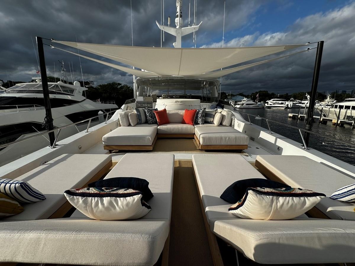 a boat with a table and chairs on it aboard INEVITABLE Yacht for Sale